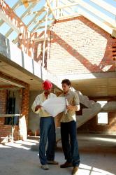 Two contractors in Basking Ridge, NJ planning work on home additions.